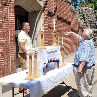 Roque and Jim fixing the altar